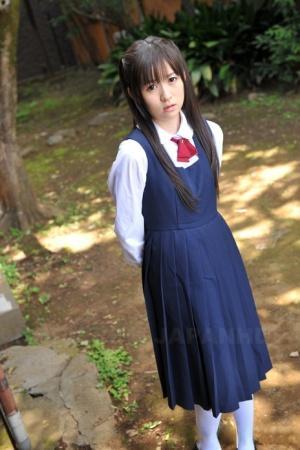 Charming Japanese babe posing in her cute school outfit in the garden