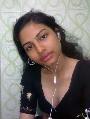 Indian wife listens to music while setting her natural tits free