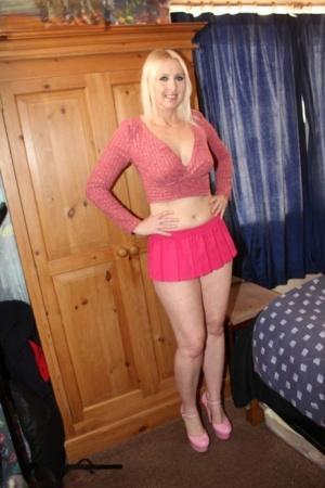 Blonde UK woman Tracey Lain has POV sex on a bed in pink heels