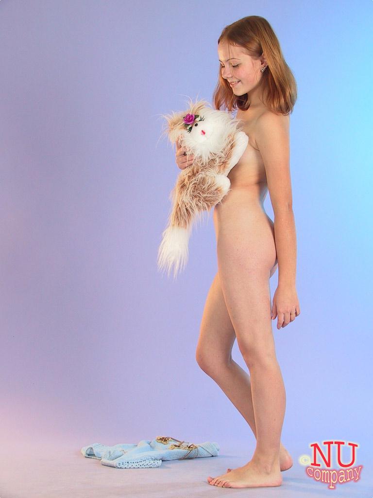 Cute redheaded teen Ola strips down naked and poses with her stuffed animal(14)