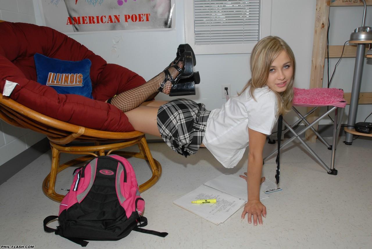 Young looking blond Kasia pulls down schoolgirl skirt in thong and nylon socks(6)