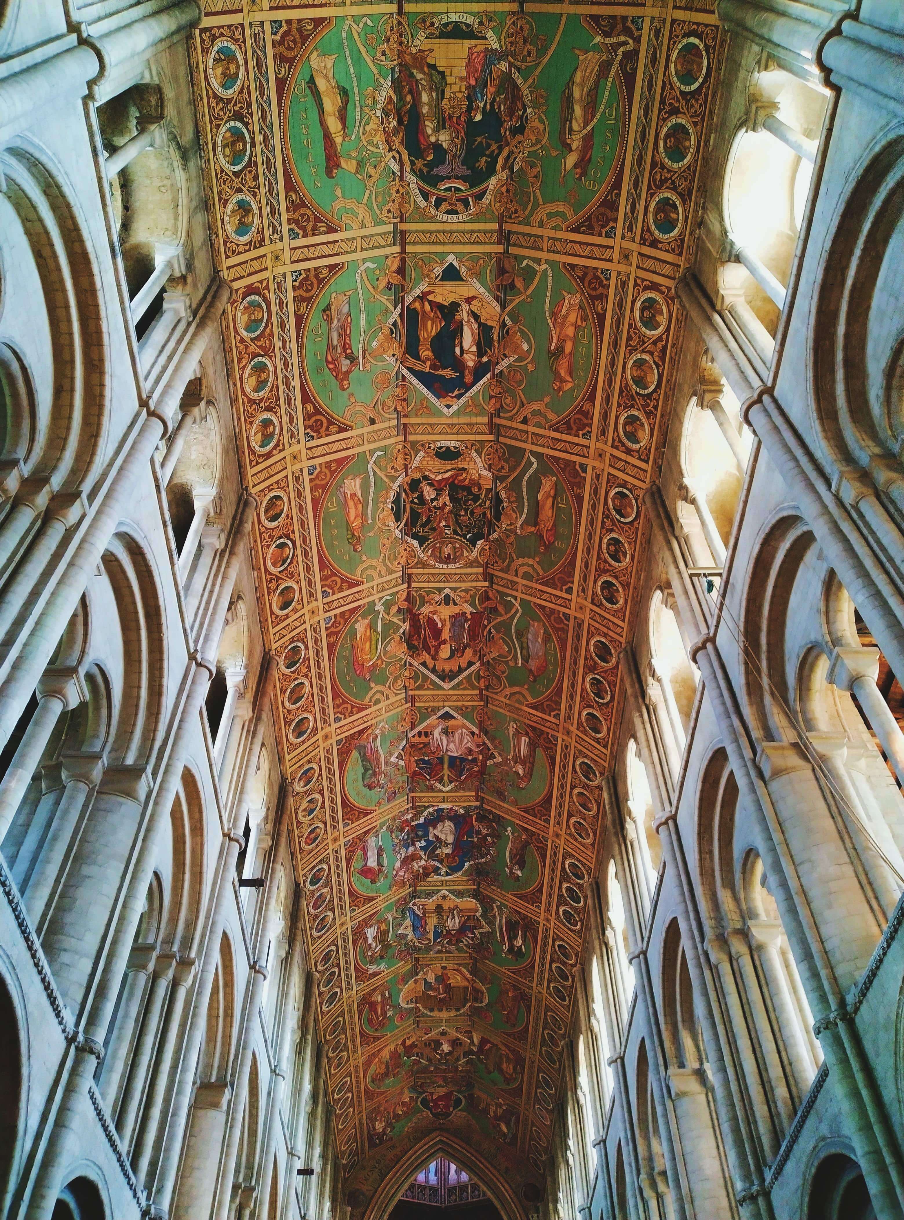 A painted mural on the ceiling of a cathedral