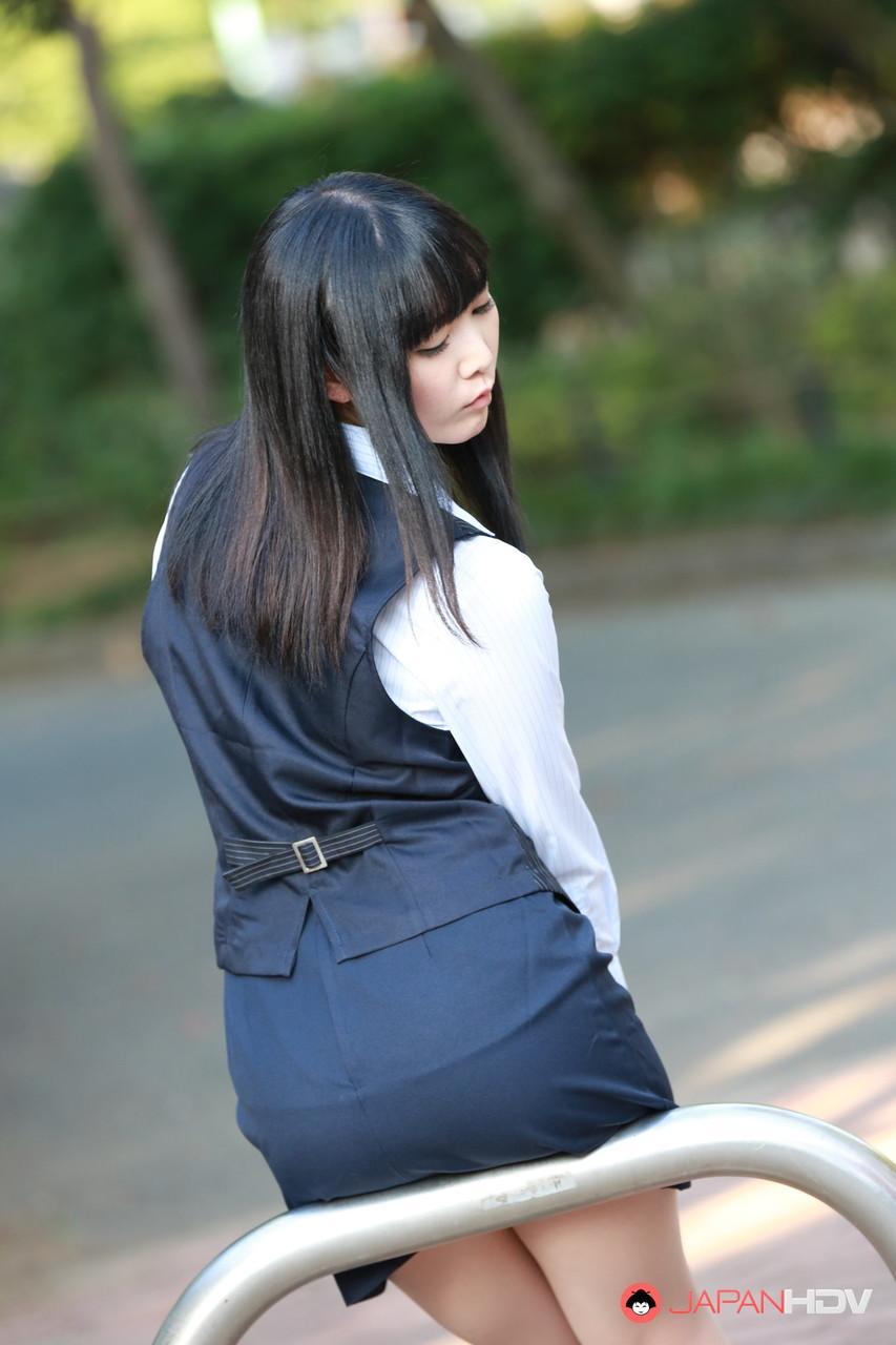 Pretty Japanese girl Yui Watanabe teases outdoors in a short skirt and heels(5)