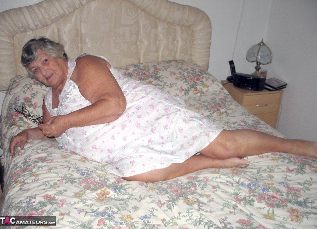 Old woman Grandma Libby grabs her fat roll after getting naked on a bed(2)