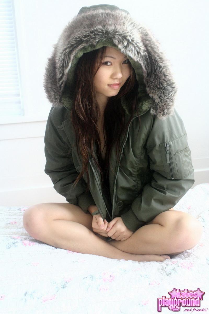 Asian amateur Grace removes a winter coat to model a thong during SFW action(7)