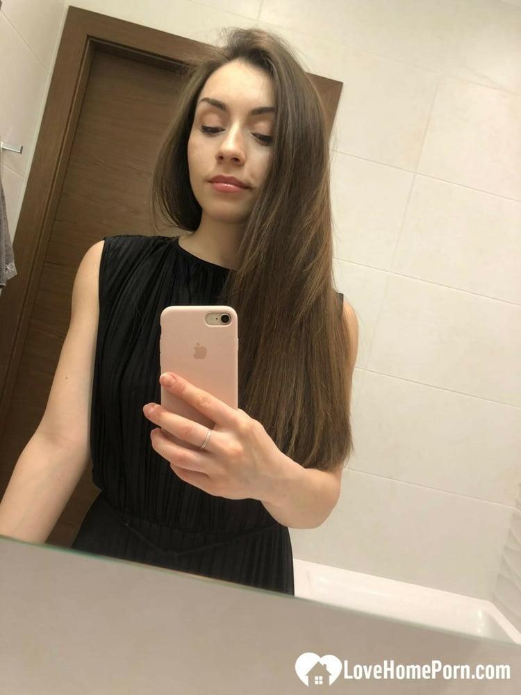 Brunette American takes selfies of her medium tits and round booty(16)