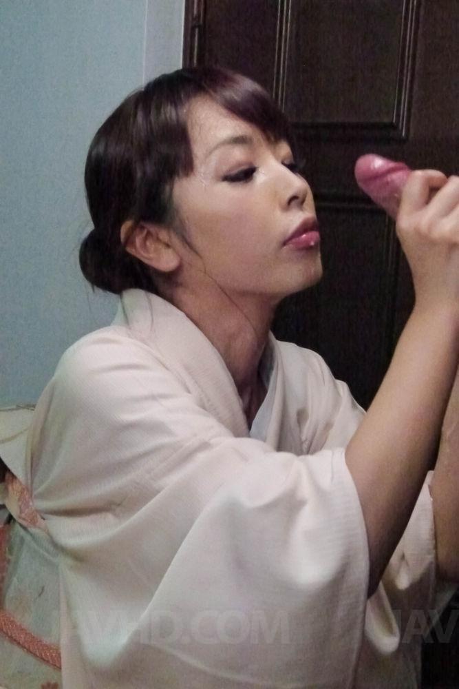 Japanese woman Marika licks jizz from a wrist to conclude a CFNM blowjob(15)