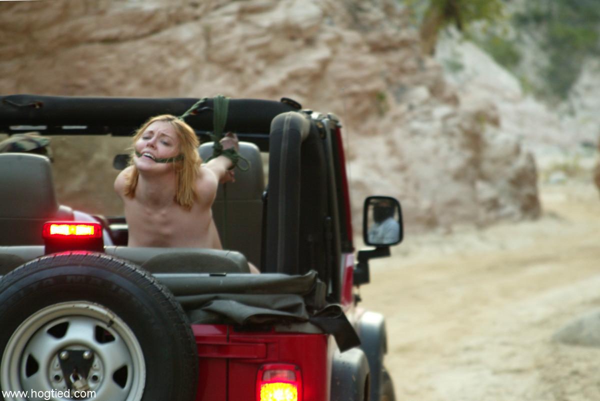 Naked MILF Dee Williams endures a rough offroad ride while standing in bondage(8)