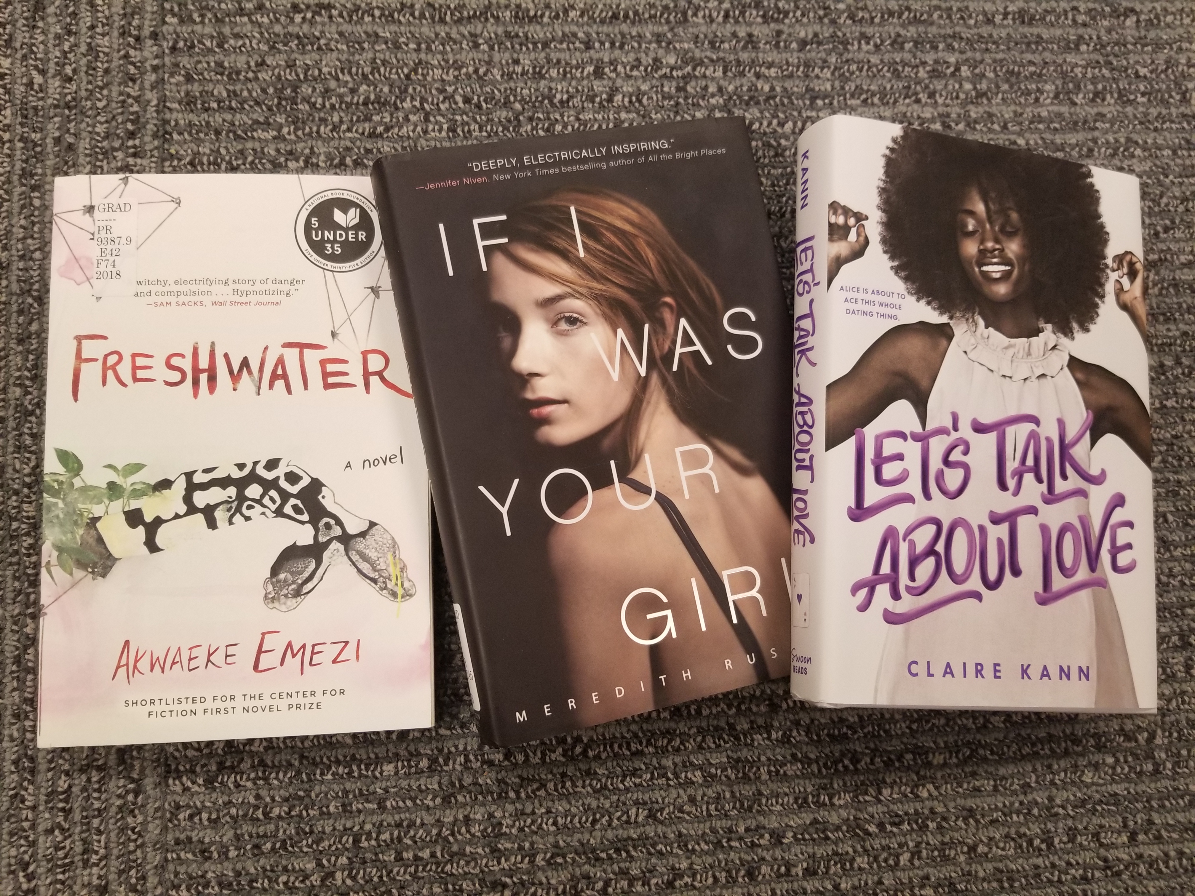 Three books laying on the floor. Freshwater, If I was Your Girl, and Let's Talk About Love. 
