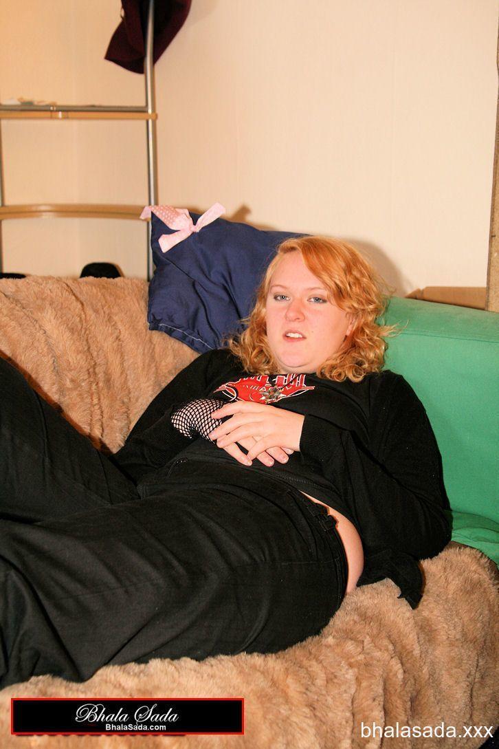 Redheaded fatty strips her sweatshirt and shows her cleavage in a black bra(10)