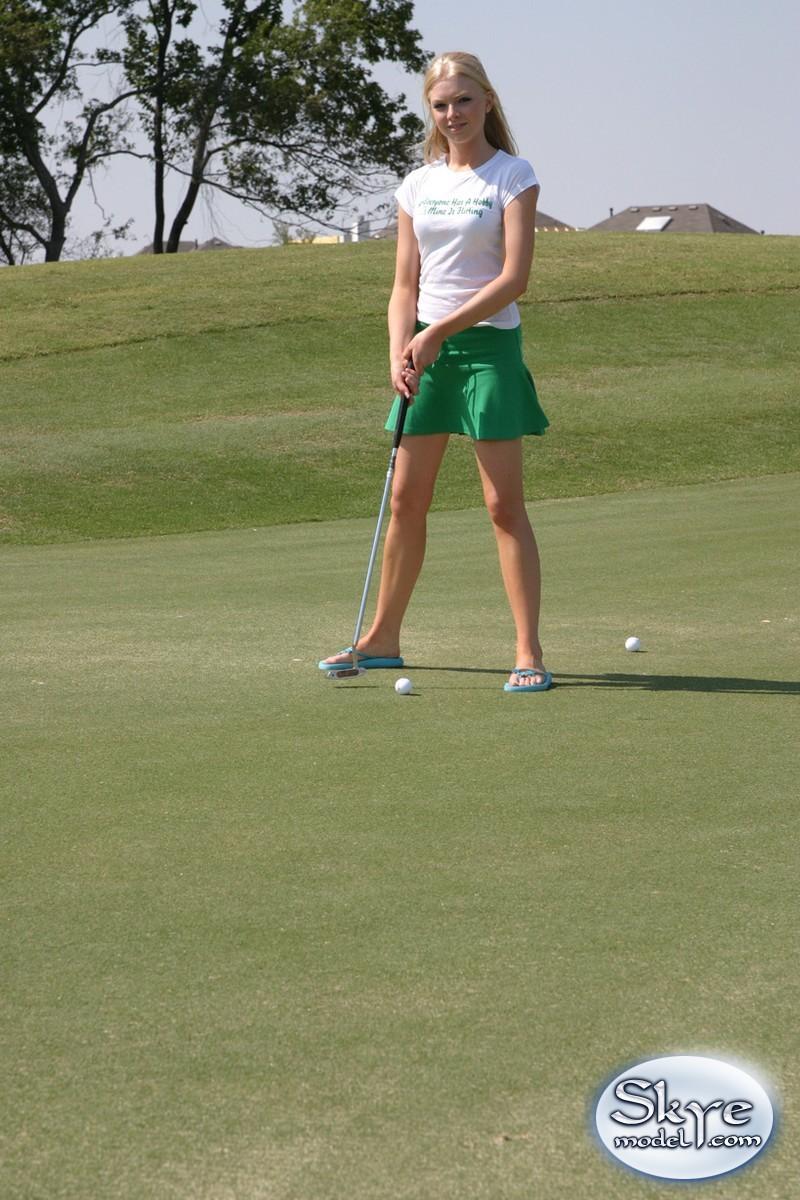 Cute blonde girl Skye Model flashes her cotton panties on the golf course(7)