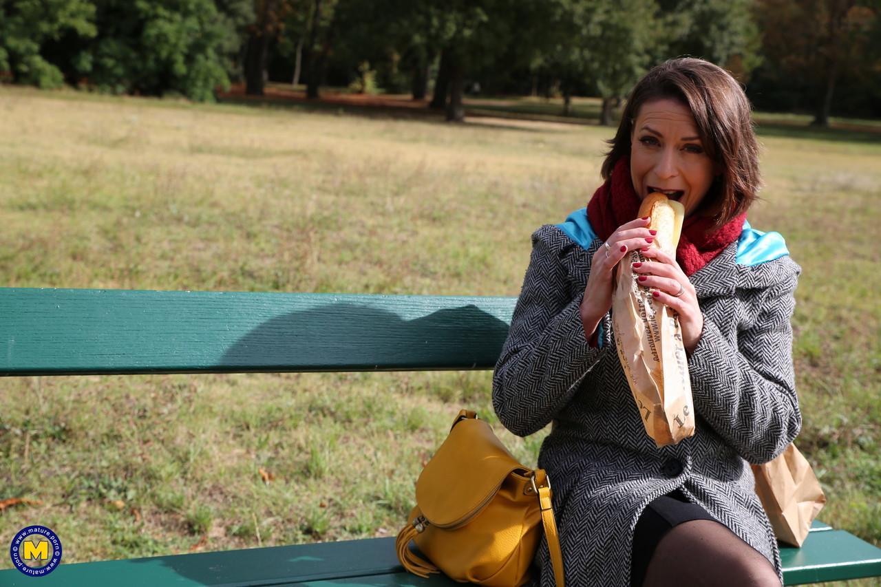 French mom Anya flashes her legs in stockings while eating a sandwich outside(6)