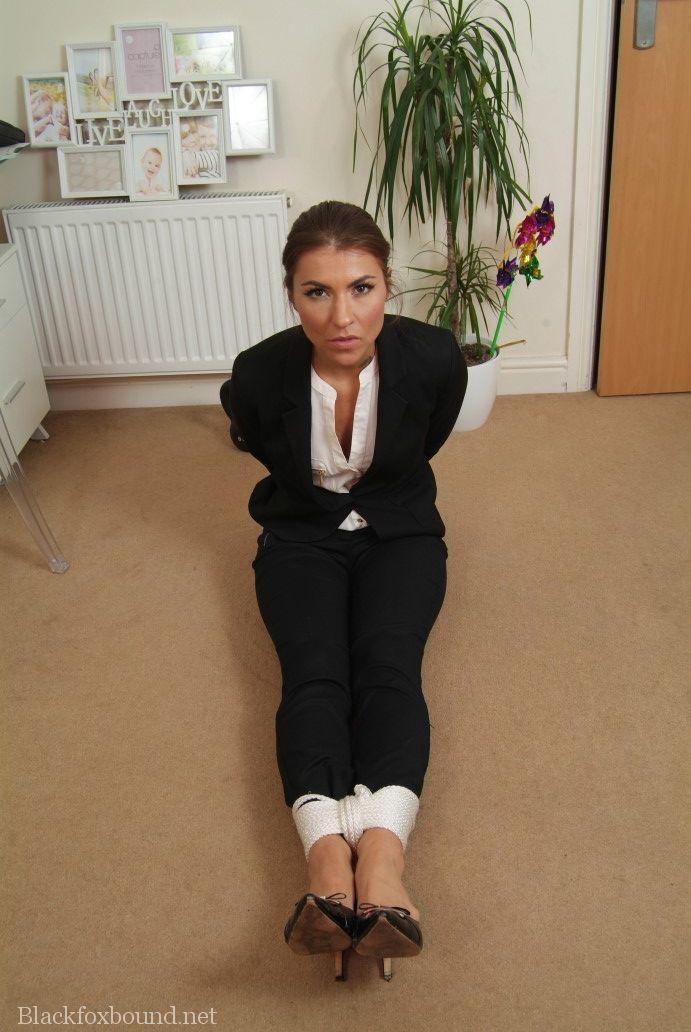 Fully clothed British secretary is tied up with rope in reception area(13)