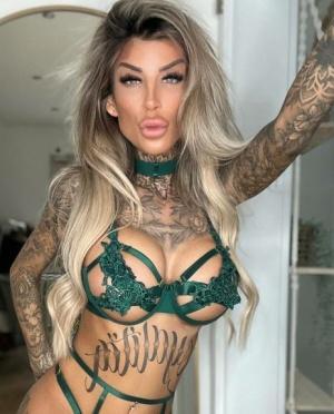 Blonde amateur Jacky Inked poses in green lacy lingerie in a sexy solo