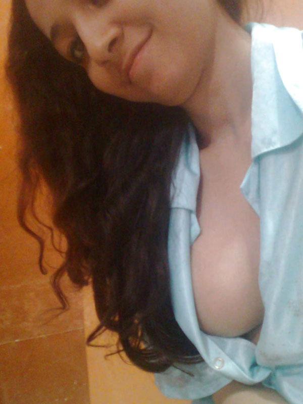 Indian solo girl holds her face firm while letting nipples free of lingerie(10)