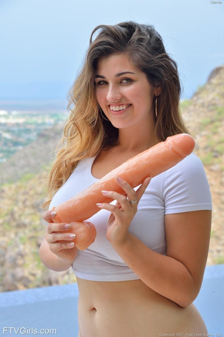 Cute teen girl inserts a huge dildo into her pussy before self fisting(13)