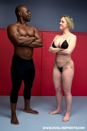 Sexy MILF Dee Williams strips and wrestles with a black guy before sex