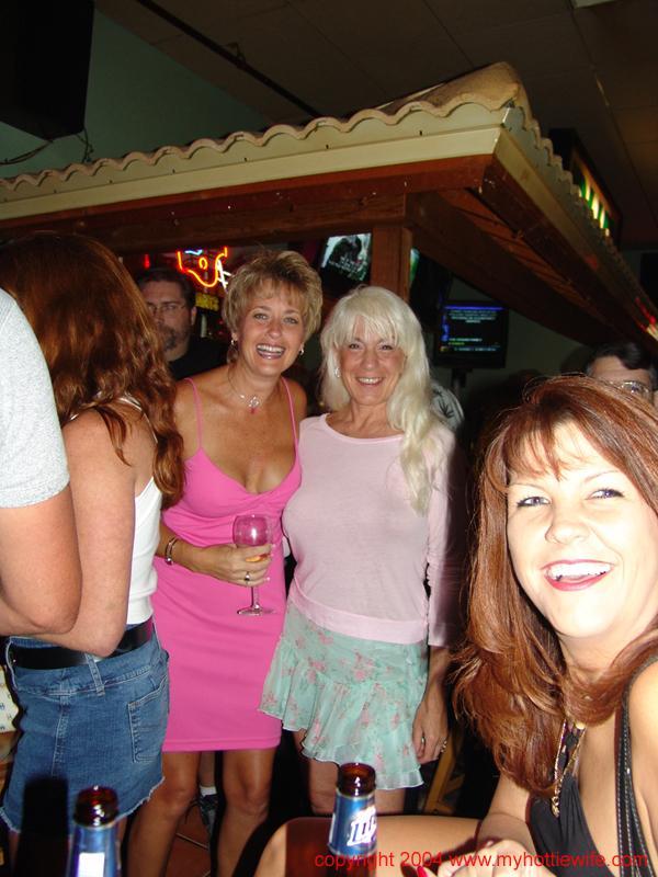 Slutty mature wives go wild and show off their big boobs at the bar(1)