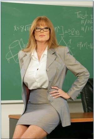 Redheaded teacher in glasses Darla Crane showing off bare MILF curves