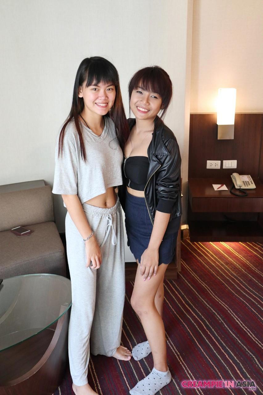 Petite Asian amateurs Sprite and Mon strip and pose naked together(2)