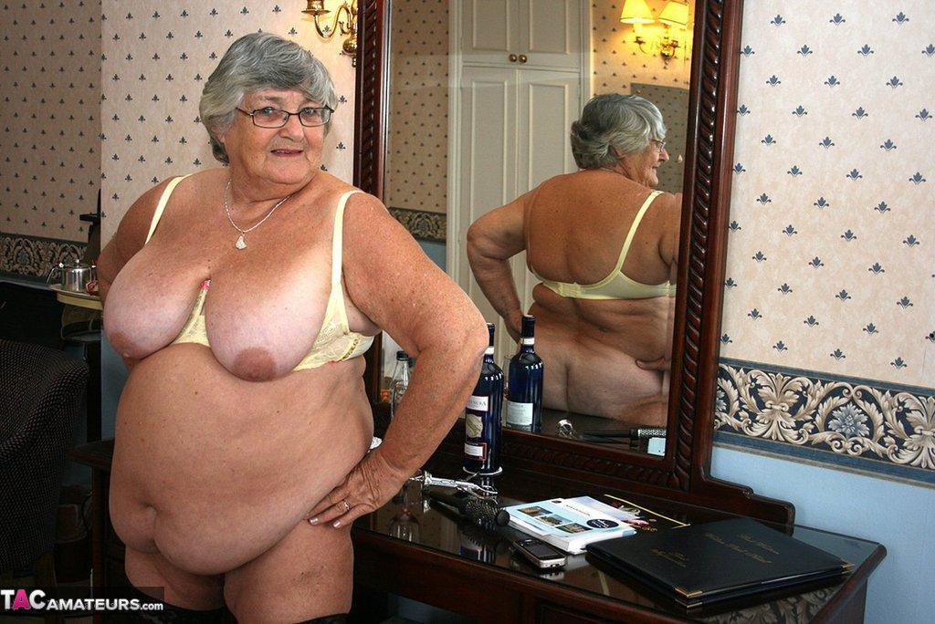 Fat grandmother with short grey hair has phone sex in black stockings only(16)