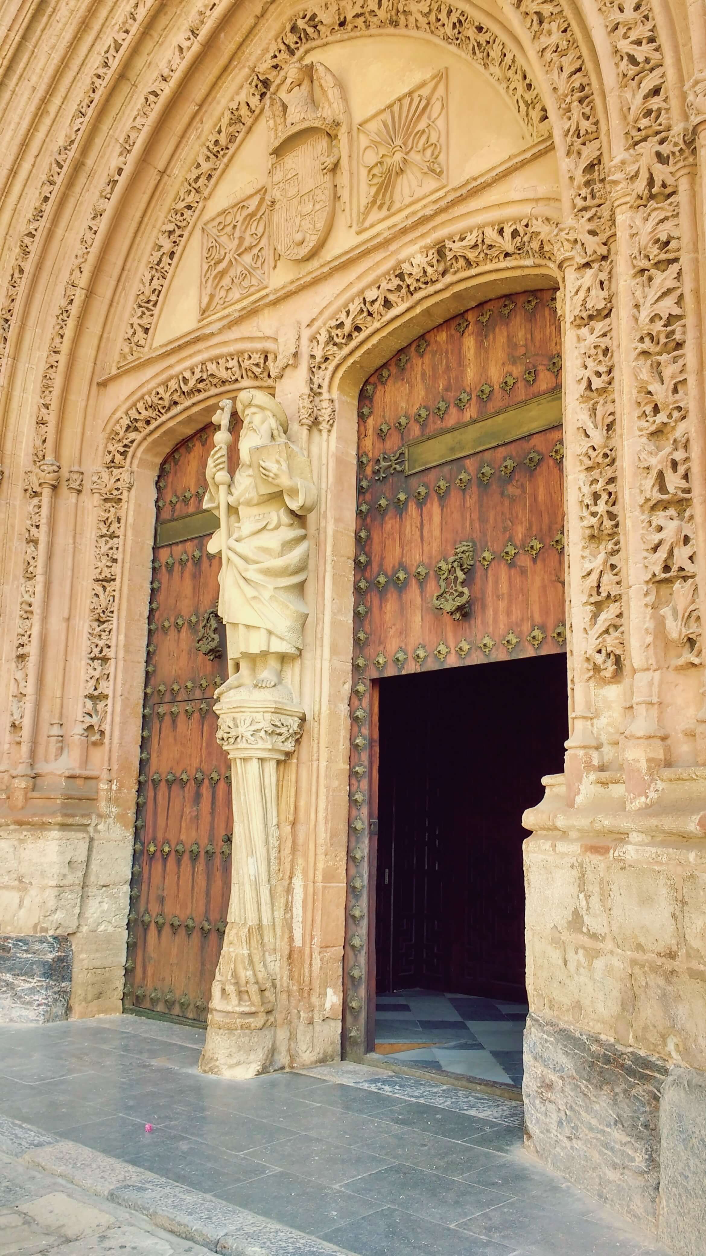 The open wooden doorway of a gothic building