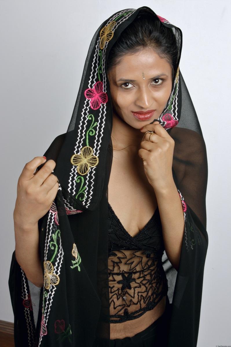 Slender Indian woman removes her sari to model in black lingerie(7)