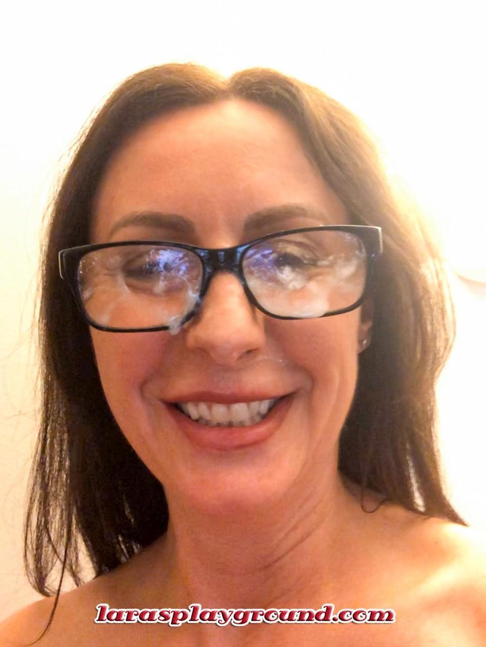 Nerdy mature woman Lara posing with jizz all over her glasses, tits & feet(2)
