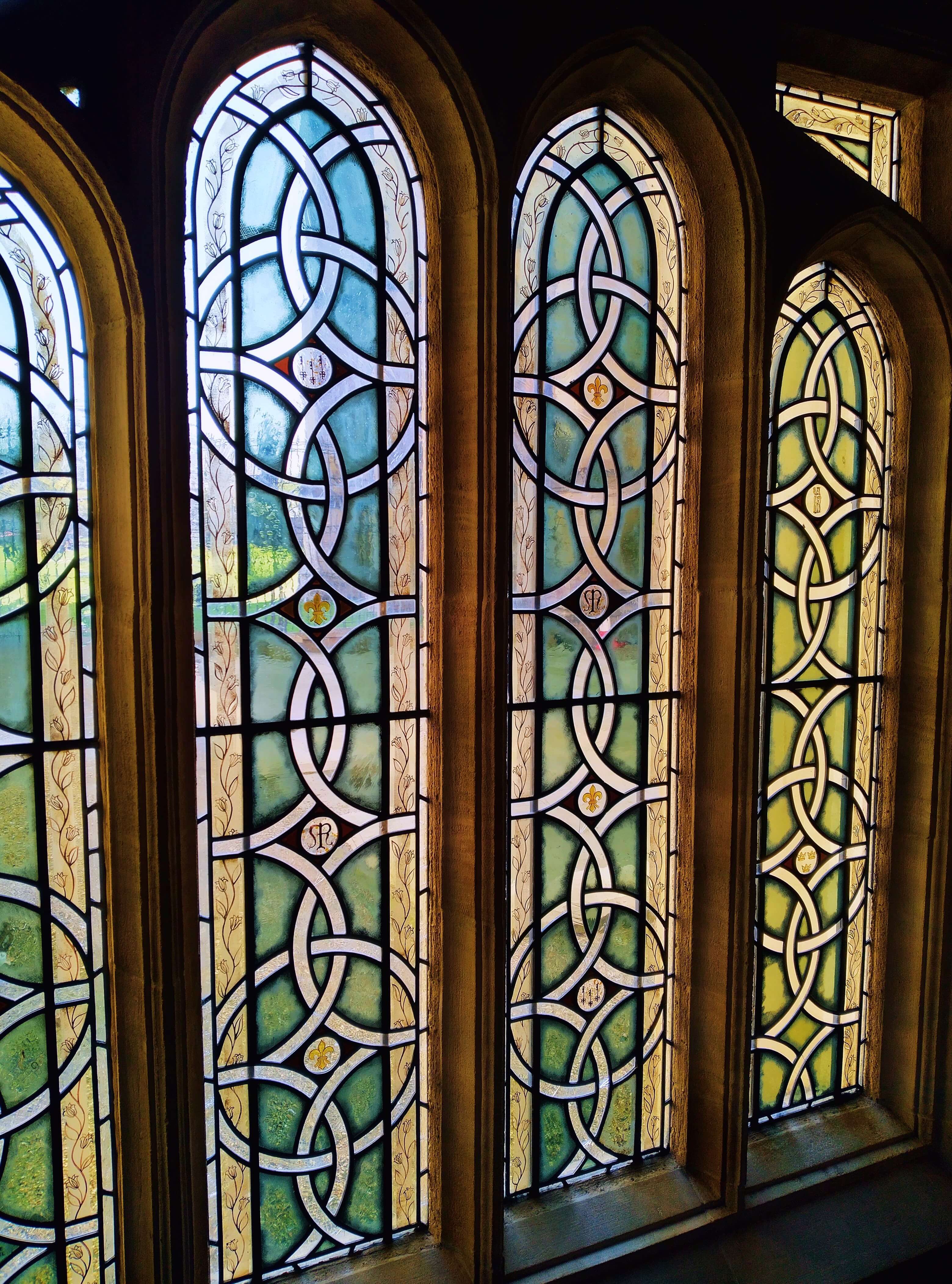 A small set of arched stained glass windows