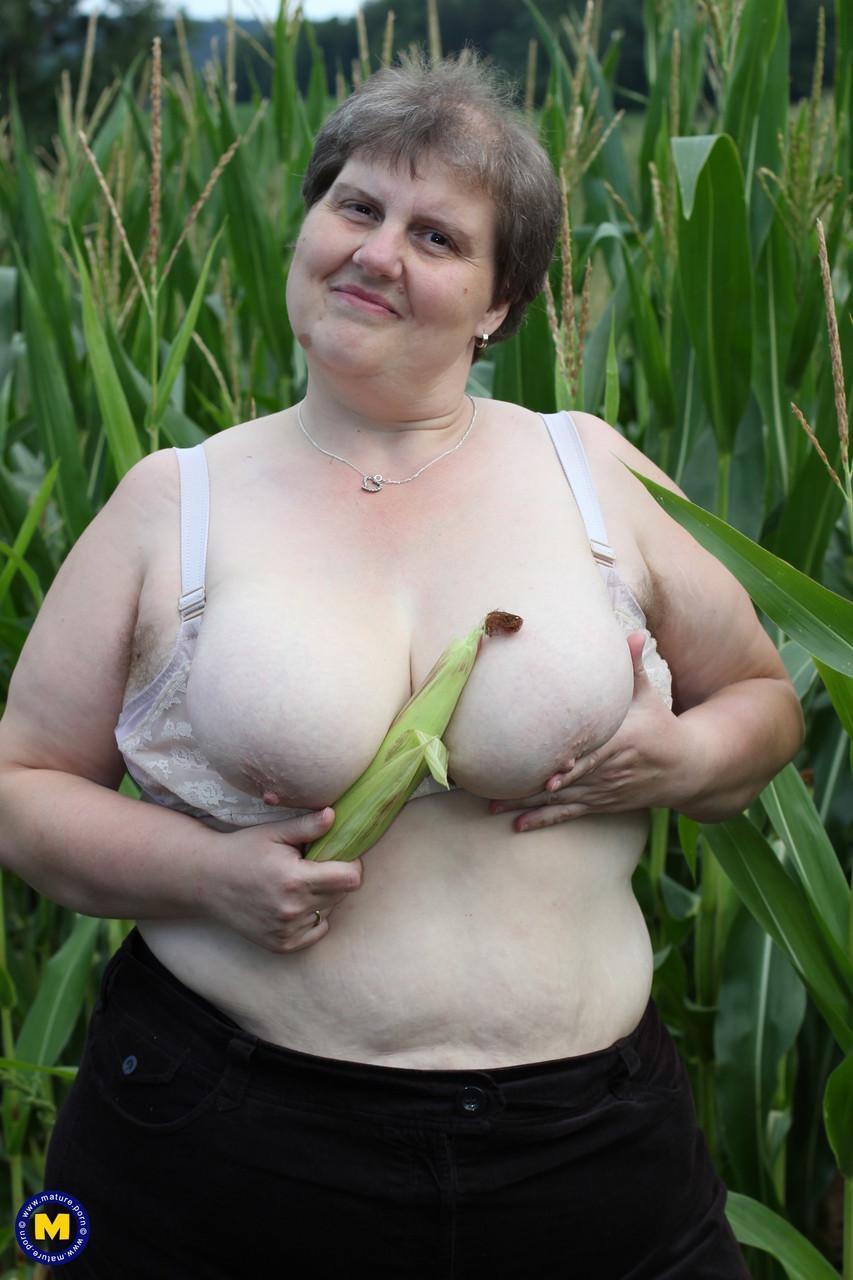 Plump European Tina C undresses in a corn field & masturbates her mature cunt(5)