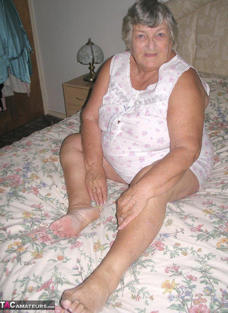 Old woman Grandma Libby grabs her fat roll after getting naked on a bed(3)