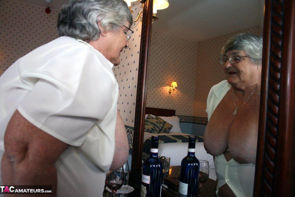 Fat grandmother with short grey hair has phone sex in black stockings only(7)