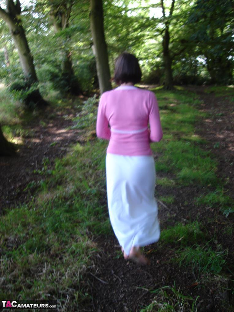 Older woman Slut Scot Susan gives a blowjob in the woods after baring her ass(1)