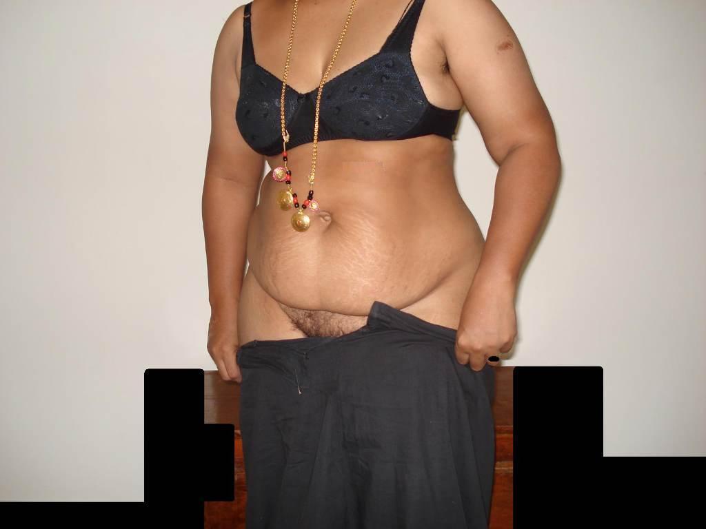 Overweight Indian housewife sports a braided ponytail while getting naked(5)