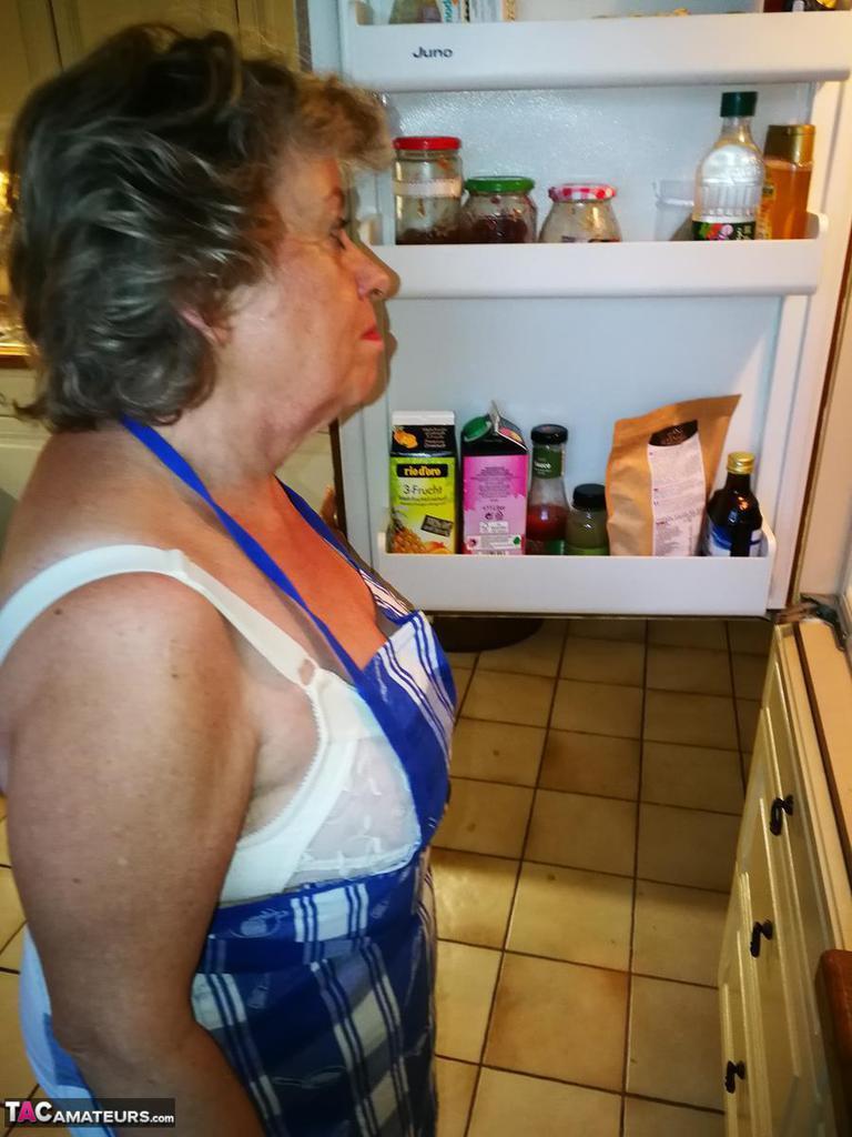 Old housewife Caro takes off her underwear in kitchen apron and stockings(1)