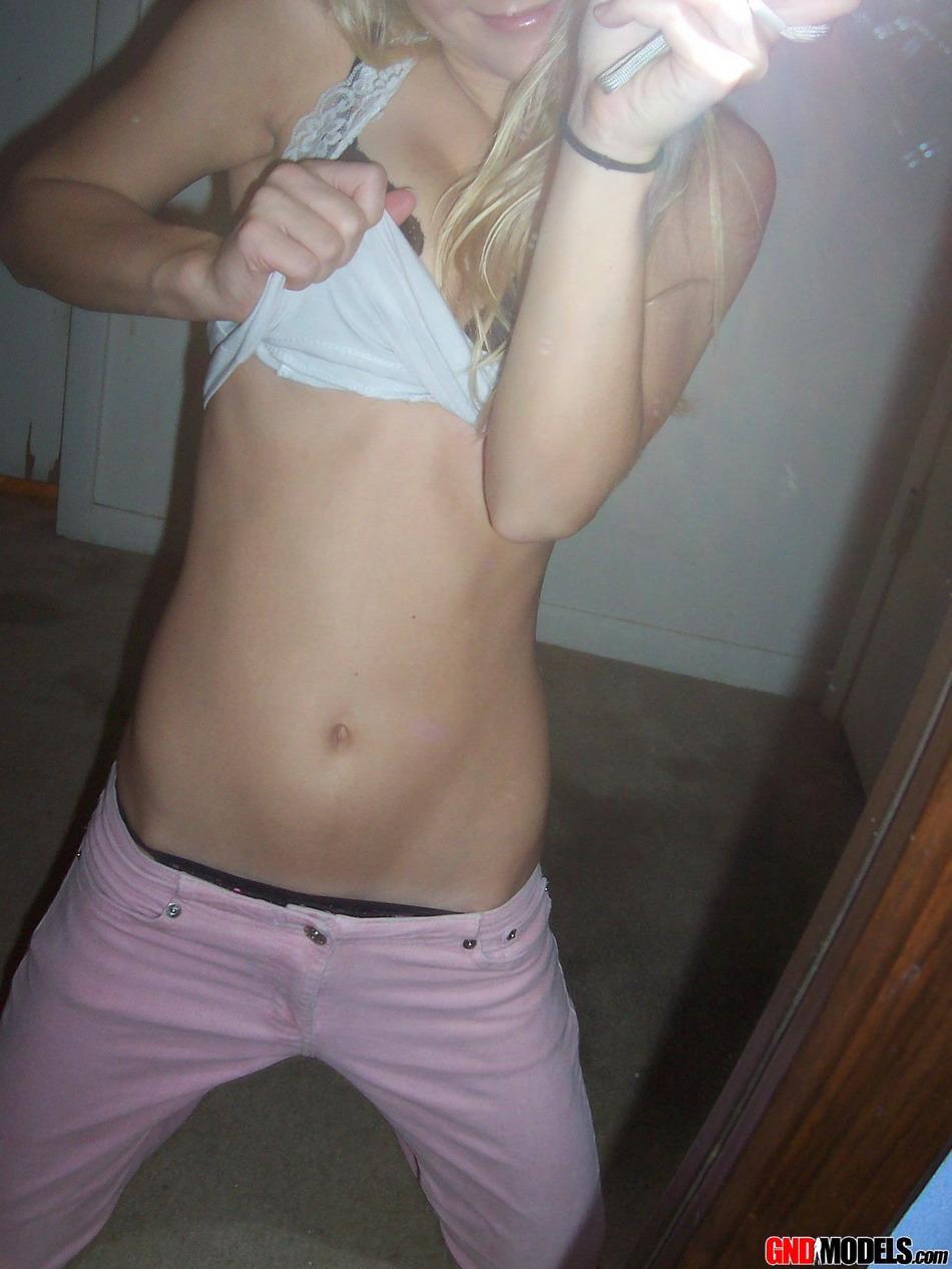 Blonde amateur Kylie takes mirror selfies while disrobing to her bra and thong(4)