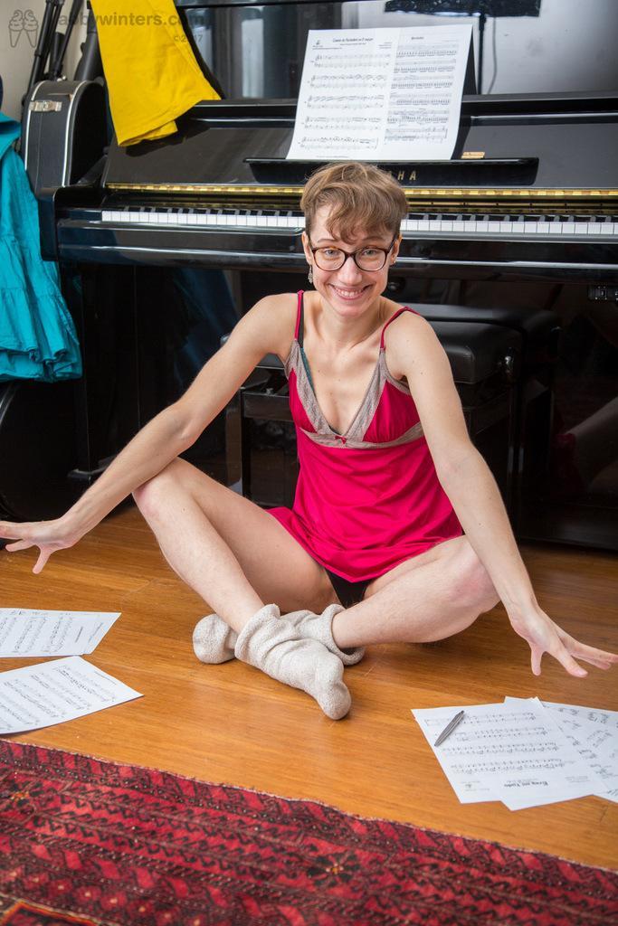 Thin amateur with short hair shows off her beaver on piano bench(3)