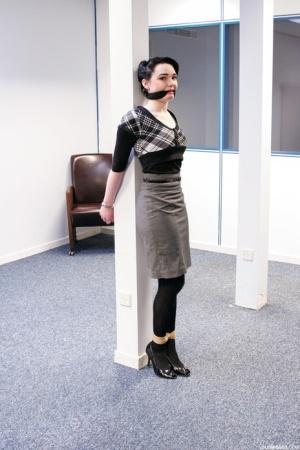 Submissive short haired cutie Lilly being tied up at the office