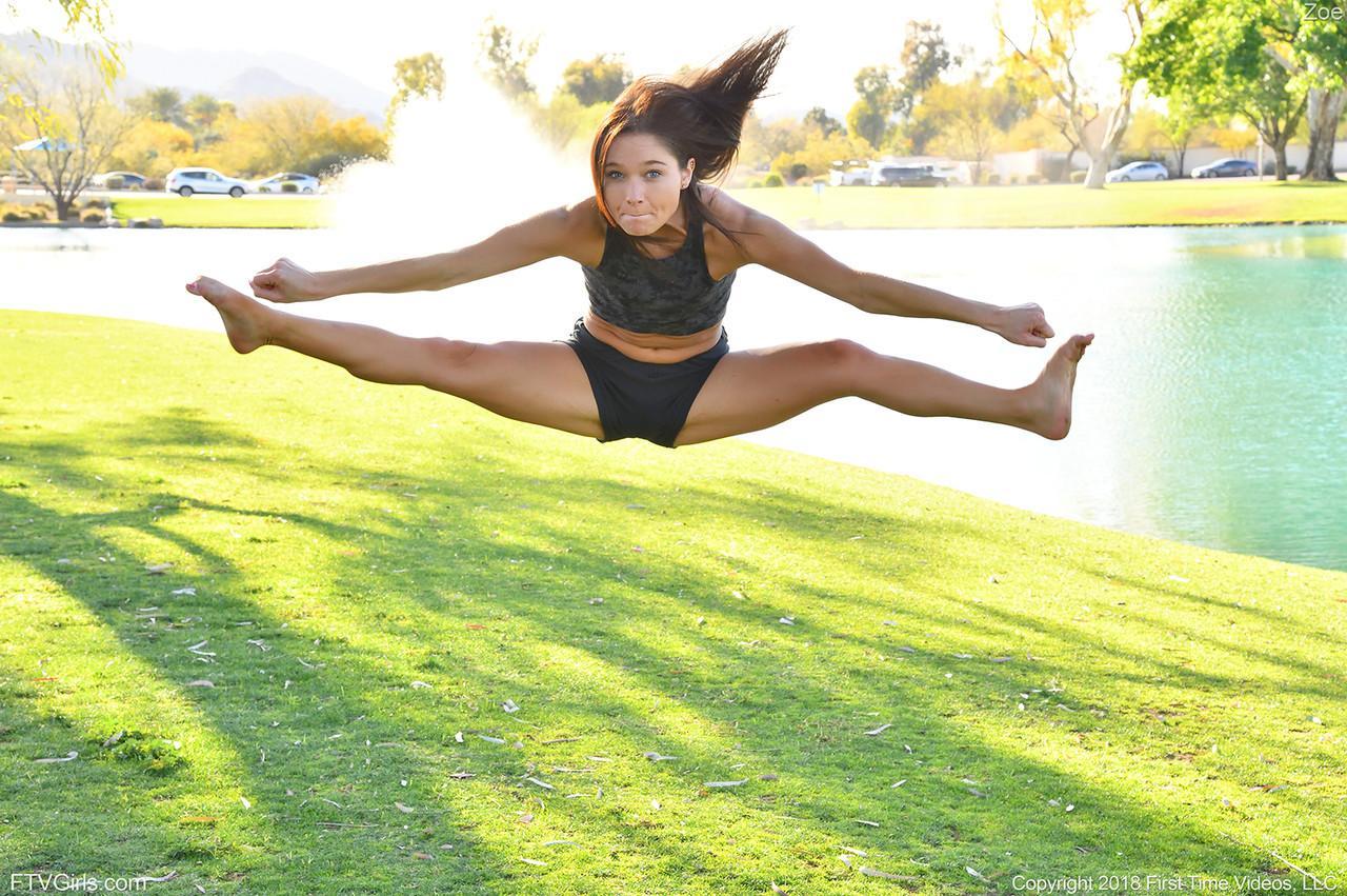 Teenage hottie in sexy outfit Zoe doing exercise outdoors by the water(9)