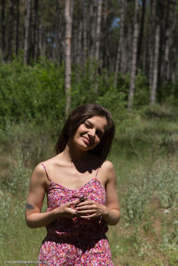 Nice teen Pola holds a pine cone while modeling totally naked in the woods(1)