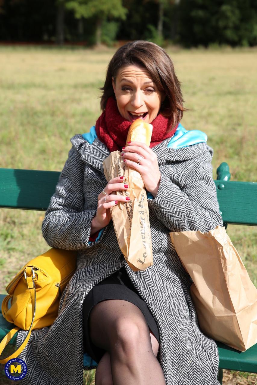 French mom Anya flashes her legs in stockings while eating a sandwich outside(3)