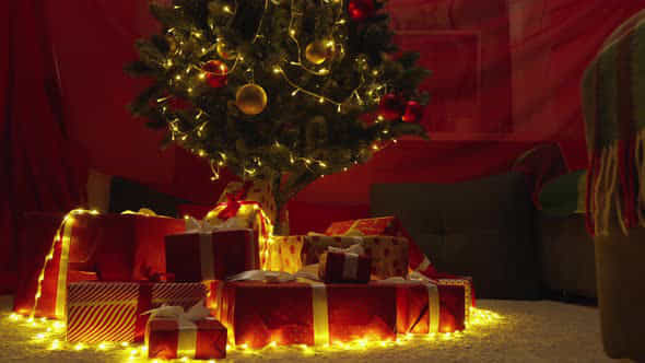 The Magic Of Christmas Wishes A Christmas Tree Decorated With Gifts Opens The Pages Of The Christmas - VideoHive 47811873