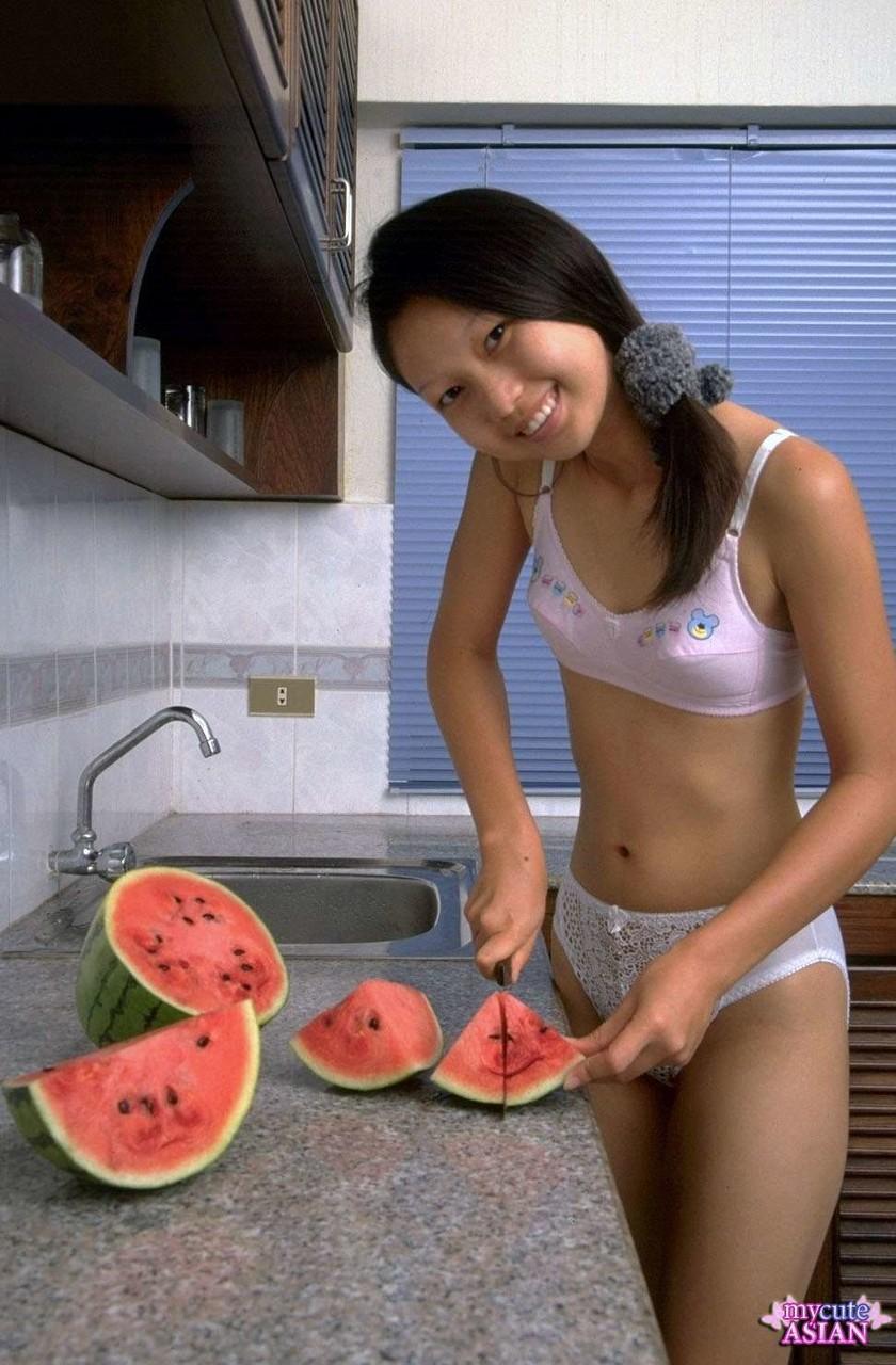 Charming Asian teen removes lace underwear while eating a watermelon(2)