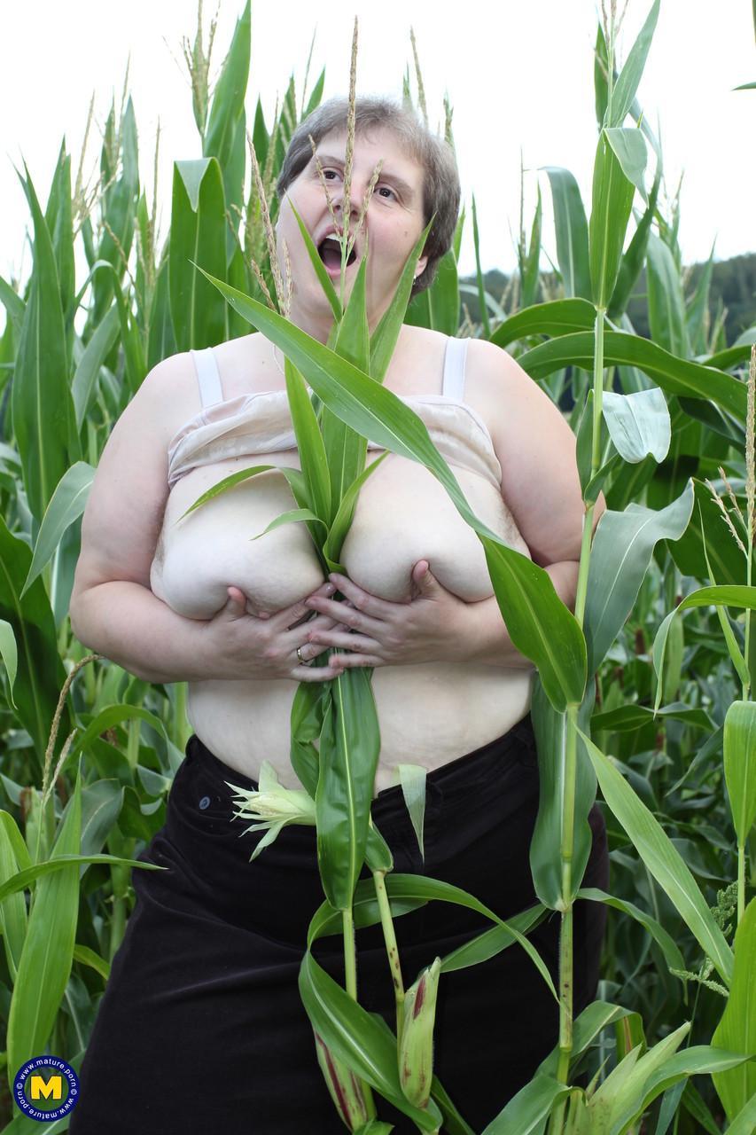 Plump European Tina C undresses in a corn field & masturbates her mature cunt(3)