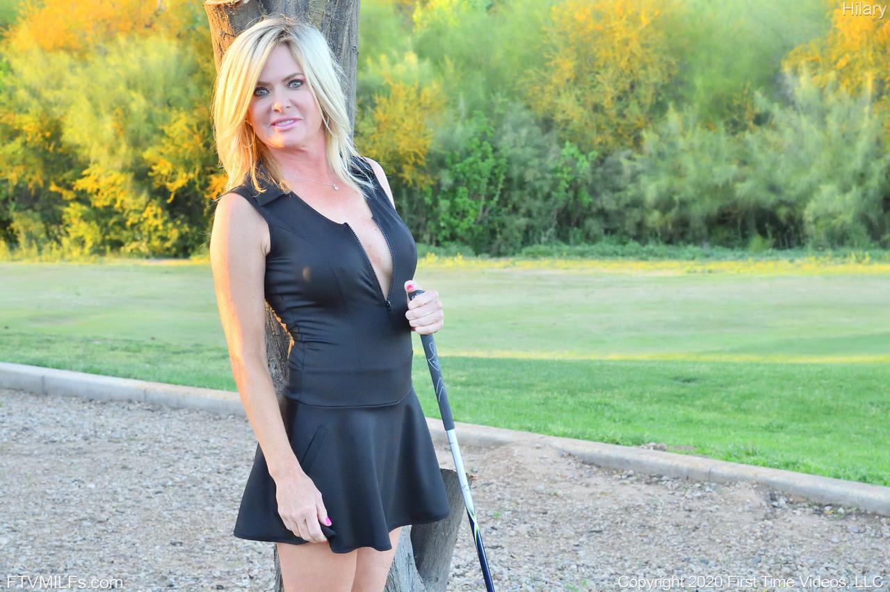 Seductress Hilary flashes her panties & shows her cleavage while playing golf(16)