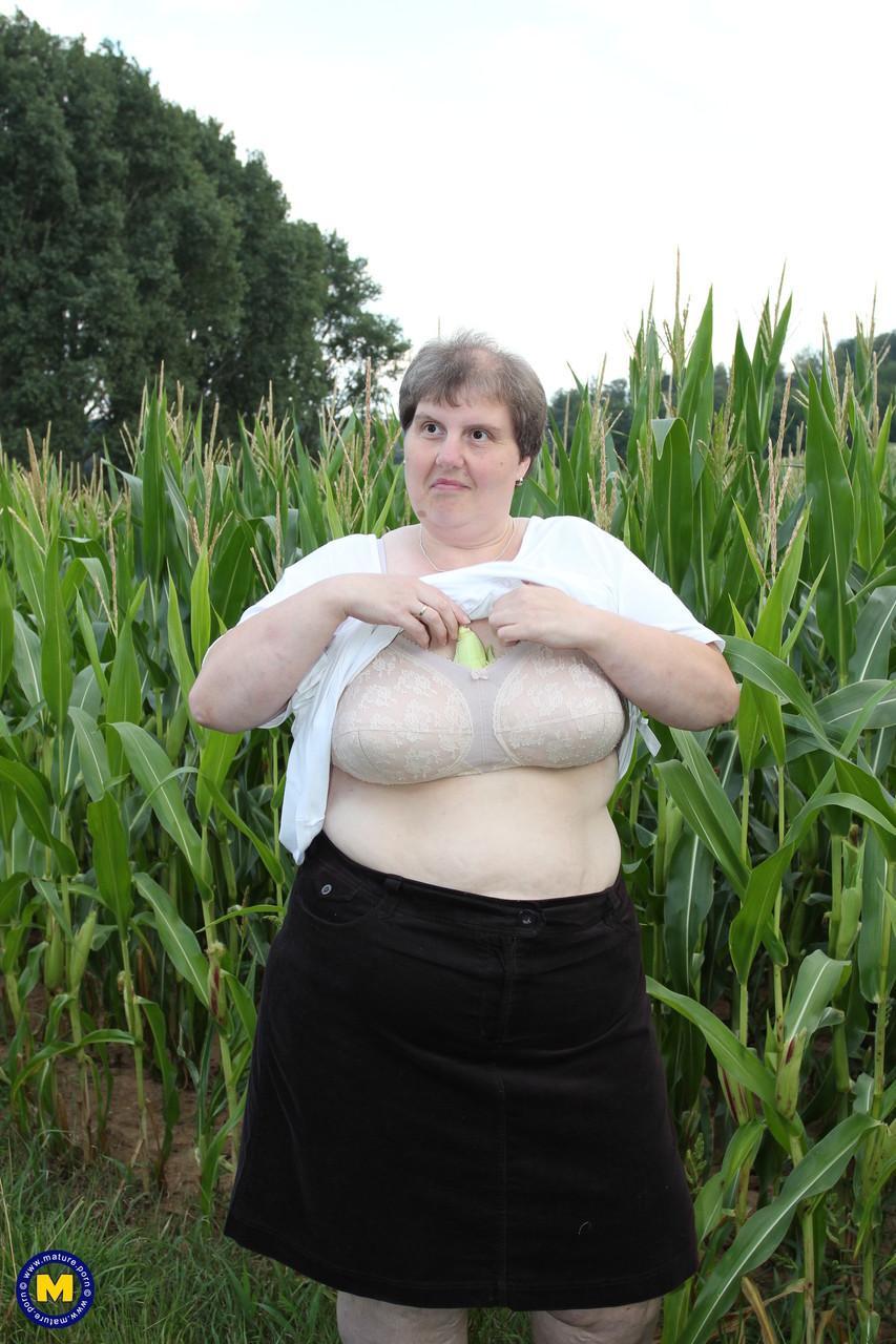 Plump European Tina C undresses in a corn field & masturbates her mature cunt(1)