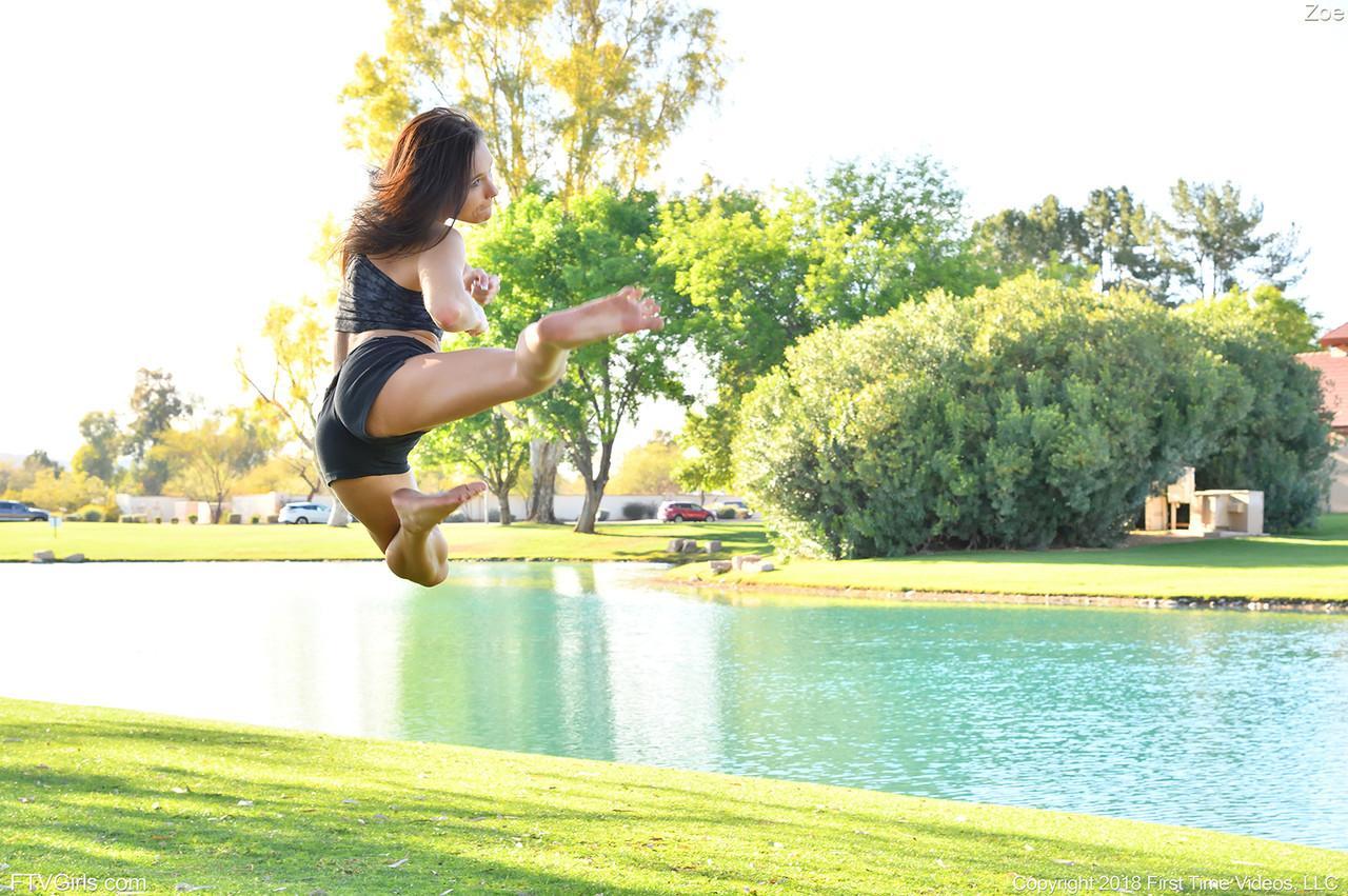 Teenage hottie in sexy outfit Zoe doing exercise outdoors by the water(6)