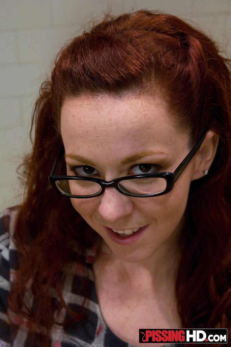 Nerdy redhead Trinity Post gets cum on glasses after blowing two dicks(1)