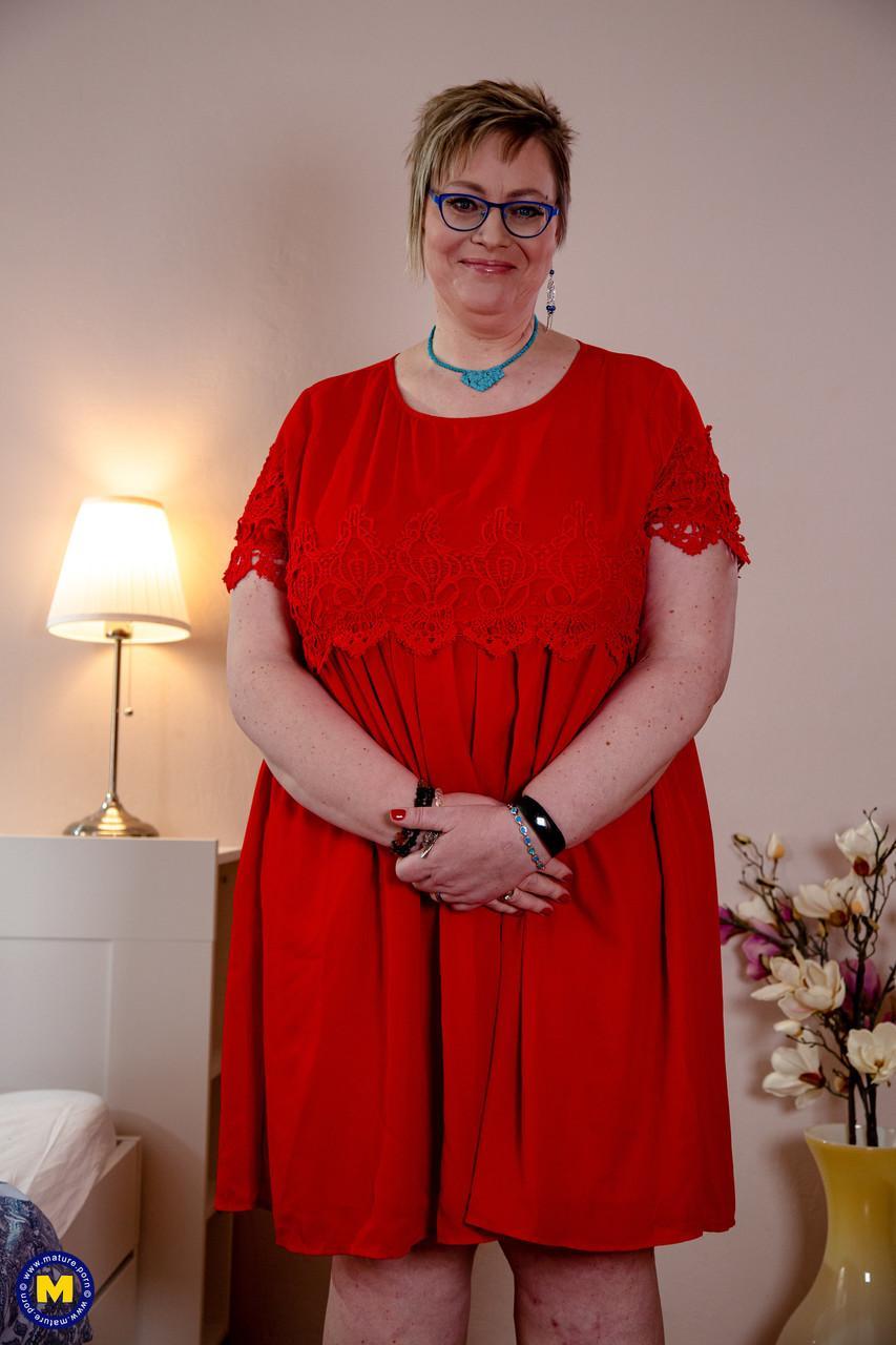 Old fatty in glasses Denisa removes her red dress & lets out her massive juggs(1)