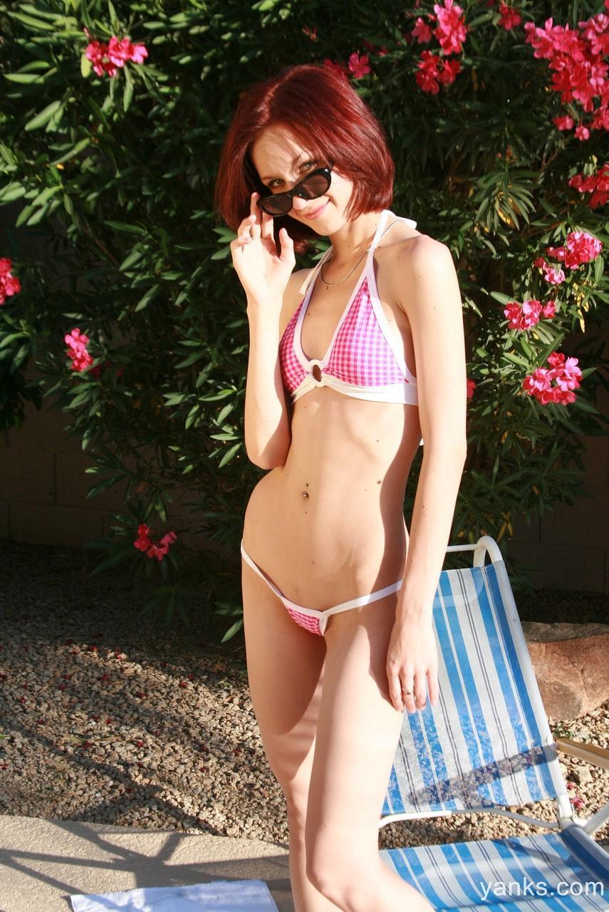 Skinny redhead Kyran masturbated with glass dildo poolside in bikini panties(1)